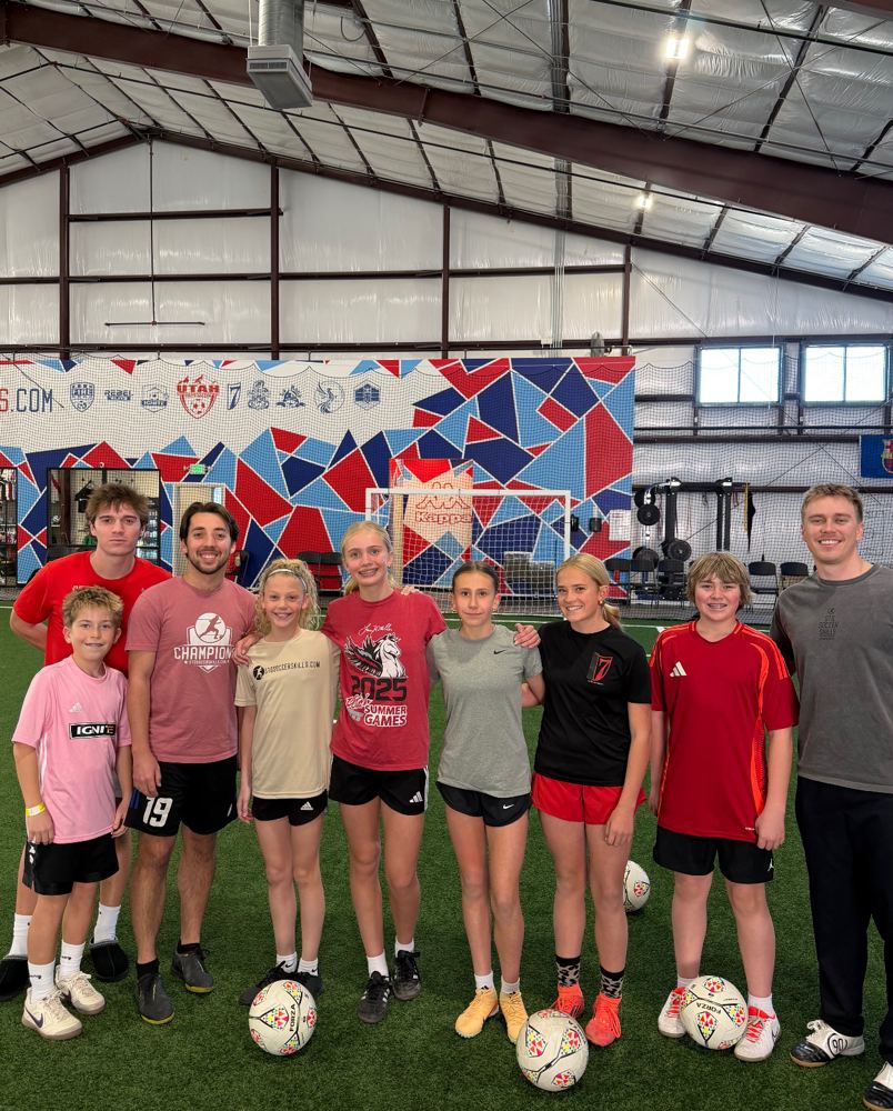STG Soccer Skills trainers and youth players on the indoor turf